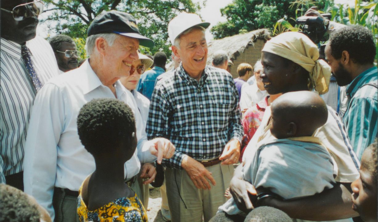 Former President Jimmy Carter and retired Merck CEO Roy Vagelos meet with people affected by river blindness